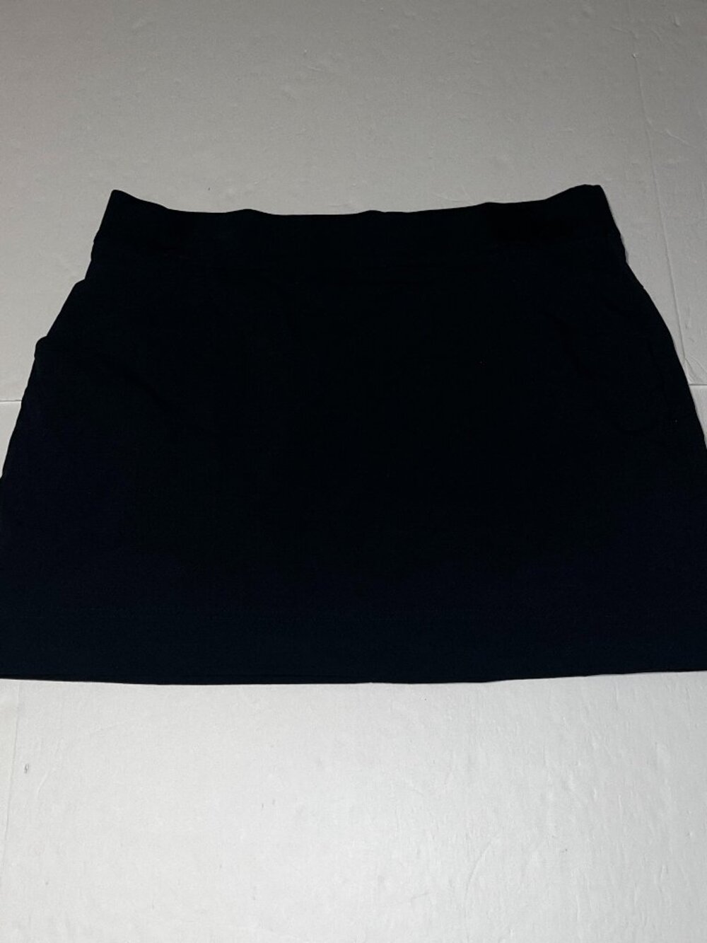 Columbia Sportswear black mini skirt with side tie detail, size XL